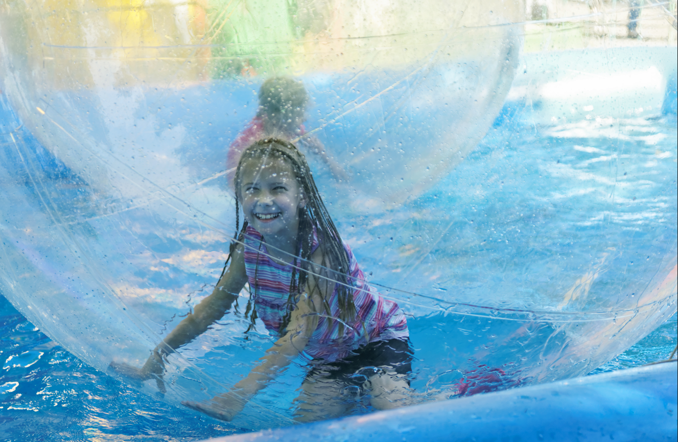 Young girl in Water Walkerz at Kielder Waterside