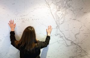 Tower Knowe Kielder Waterside - Young girl looking at big map of Kielder Water